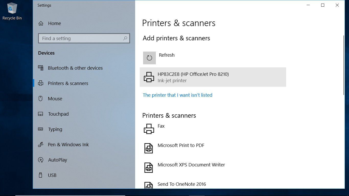 Снимок экрана, показывающий, как выбрать принтер в настройках принтеров и сканеров в Windows 10