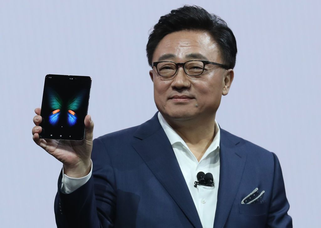 Samsung's DJ Koh holds up a Galaxy Fold
